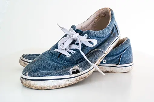 Old, torn sneakers