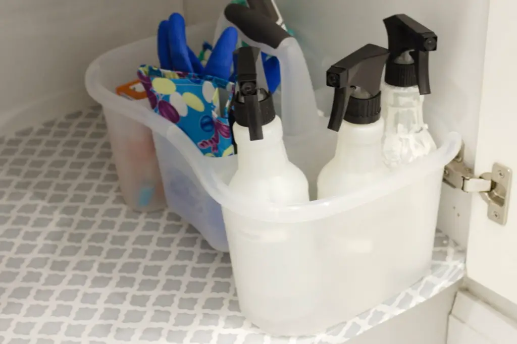 bathroom cleaning caddy in cupboard