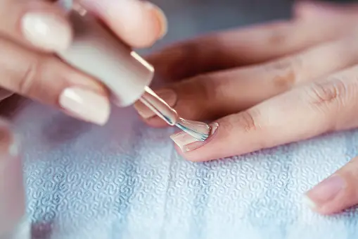 Woman doing own manicure