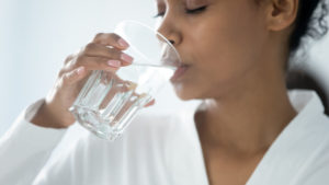 Woman drinking a glass of water