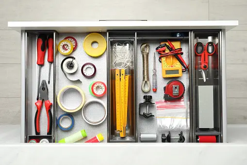 Neatly organized items in an open drawer