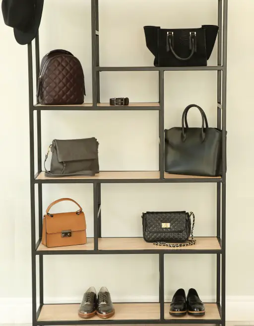 Purses organized on a bookshelf -2