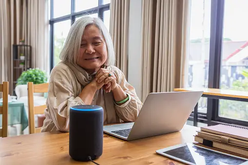 Senior woman using Alexa