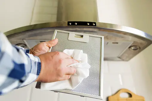 hand cleaning range hood filter