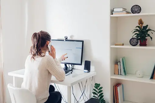 Woman on phone in home office